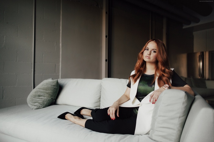 Debby Ryan on a couch
