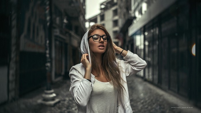 Woman with glasses in the rain, fashion photography