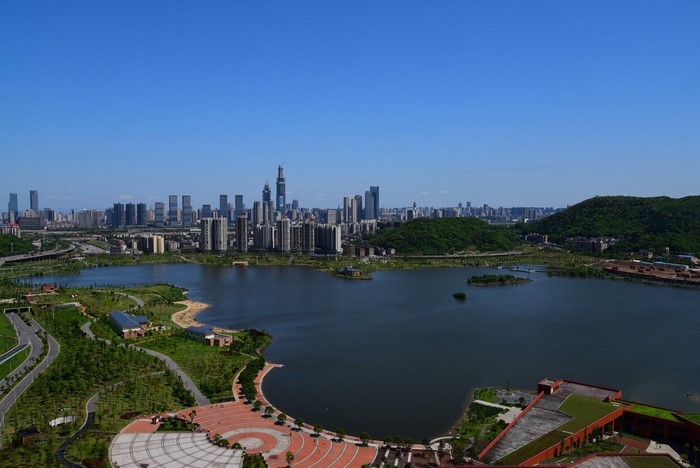 Cityscape with lake and green hills in Changsha, China