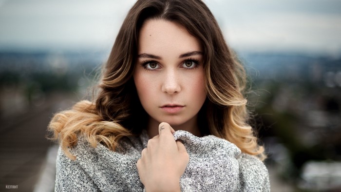 Portrait of a young woman with long brown hair