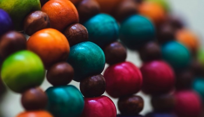 Colorful wooden beads in macro photography