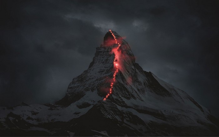 Matterhorn mountain with red lights in the Alps