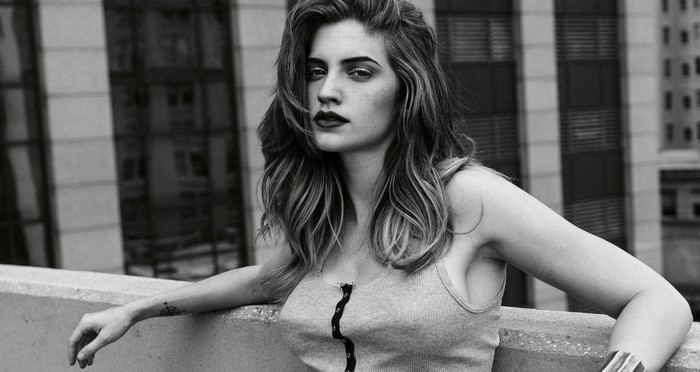 Monochrome portrait of a woman with wavy hair