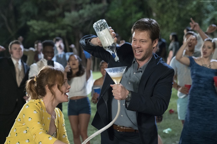 Ike Barinholtz and Leslie Mann at a party