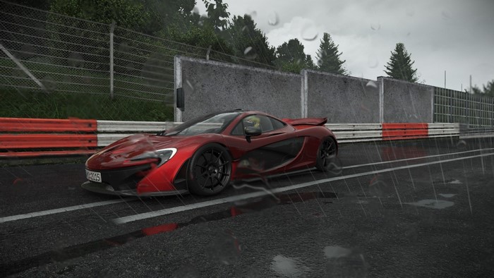 Red McLaren P1 sports car on a wet race track