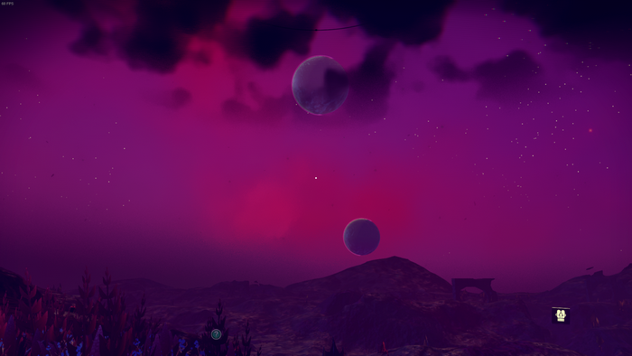 No Man's Sky alien planet with two moons at night