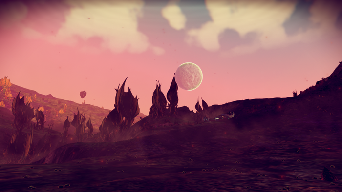 No Man's Sky alien planet landscape with moon
