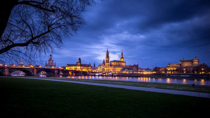 Dresden cityscape with Elbe River and bridge at dusk