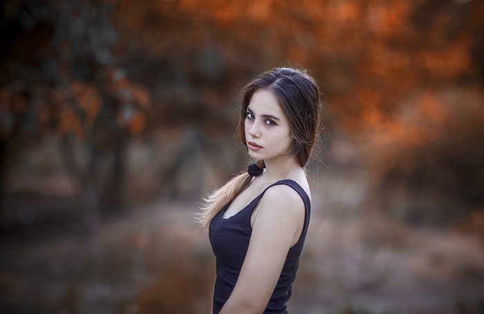 Woman with ponytail in tank top outdoors