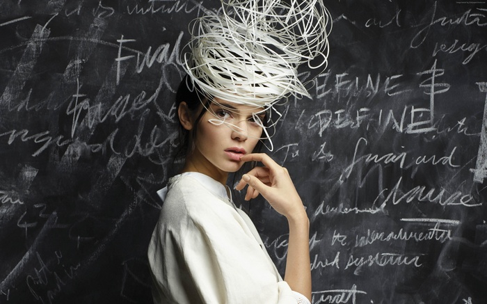 Kendall Jenner in a white outfit and hat