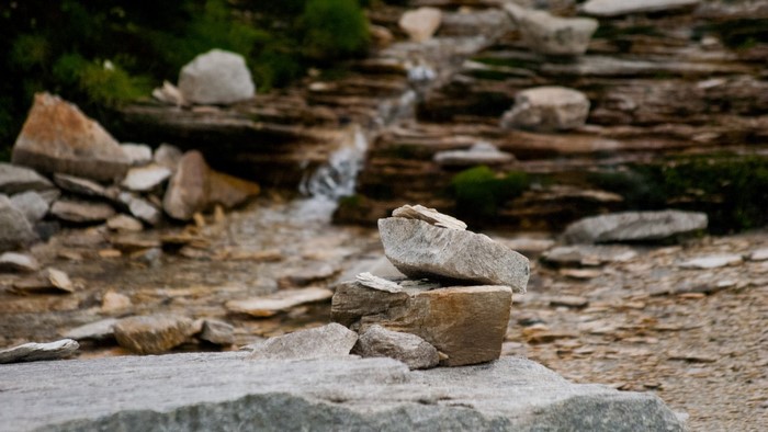 Stack of stones near a rocky stream