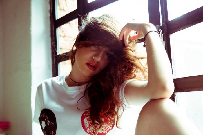 Woman with red lipstick and hair in face