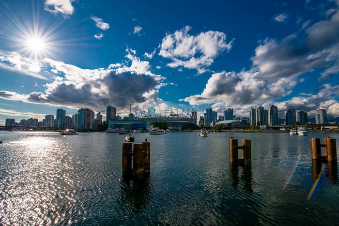 Vancouver cityscape with stadium and boats on the water