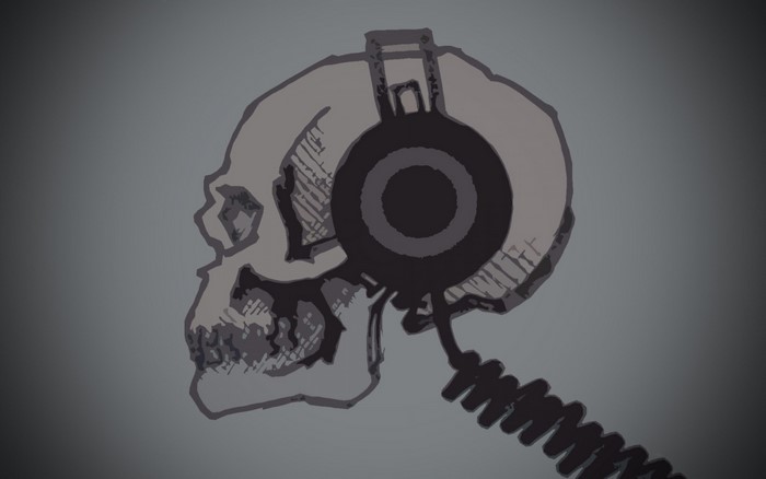 Skull wearing headphones with coiled cable