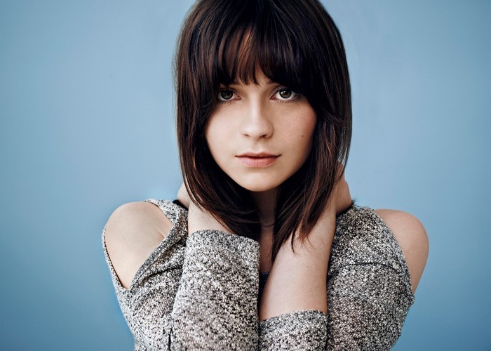 Gabrielle Aplin portrait with bangs and sparkly top