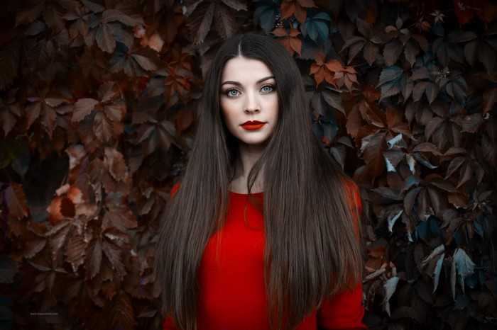 Woman with long straight hair and red lipstick