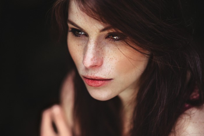 Close up portrait of a woman with freckles
