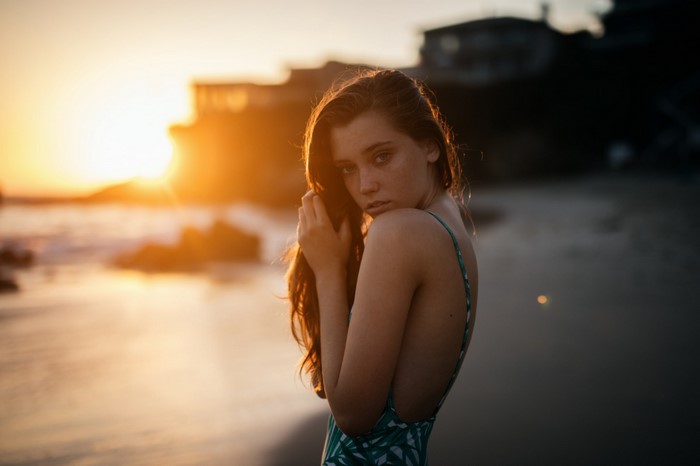 Woman on beach at sunset