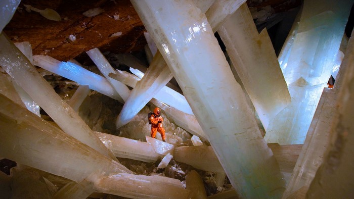 Cave with giant selenite crystals and a person
