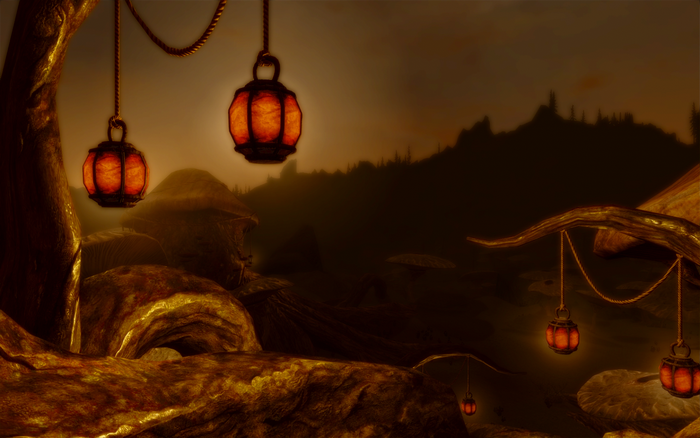 Lanterns hanging in a dark, rocky landscape from The Elder Scrolls V Skyrim