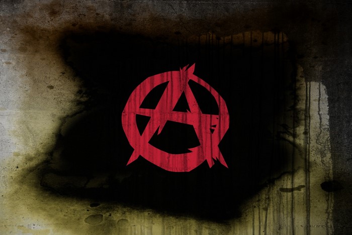 Red Anarchy Symbol on Grunge Background