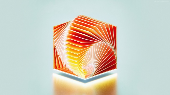 Abstract cube with swirling orange and yellow paper layers
