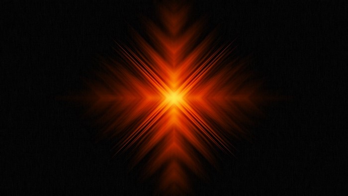 Abstract orange starburst on black background