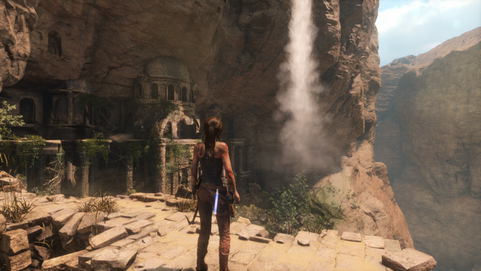 Lara Croft in ancient ruins with a waterfall