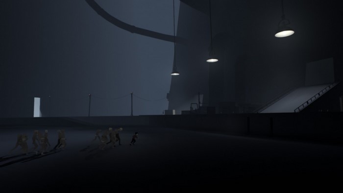Boy running from figures in dark industrial area