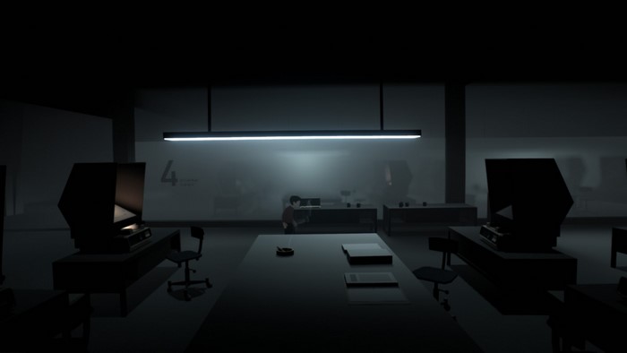 Boy in a dark room with computers
