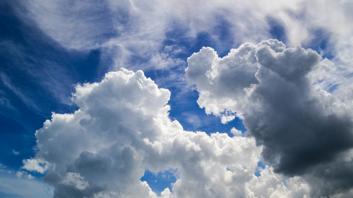 Cumulus clouds against a blue sky