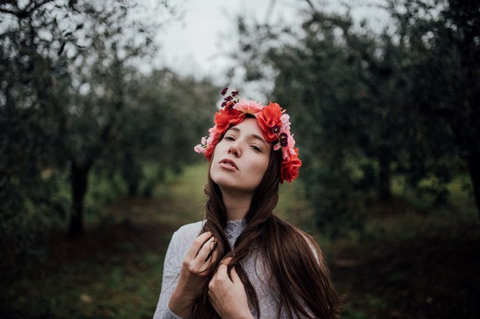 Woman with flower crown in forest