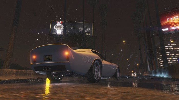 Sports car driving on a rainy highway at night in Grand Theft Auto V