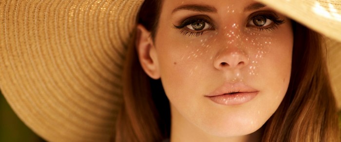 Lana Del Rey wearing a straw hat