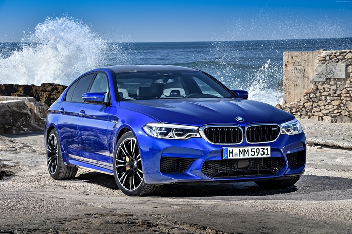 Blue 2018 BMW M5 Sedan by the Ocean