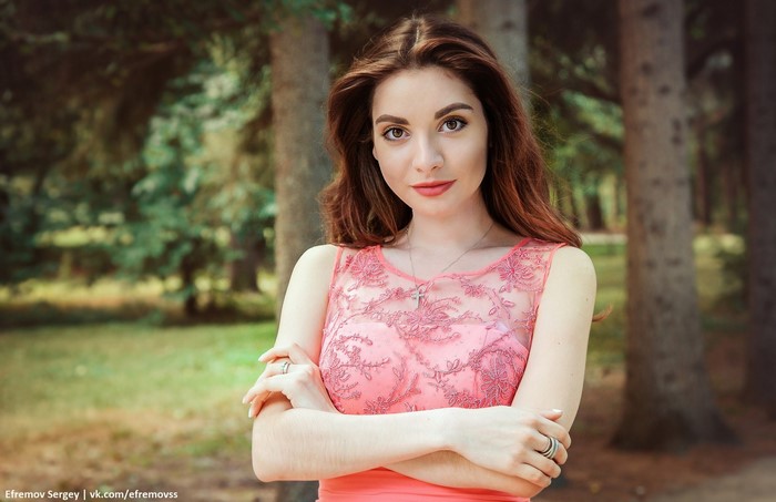 Woman in pink dress in park