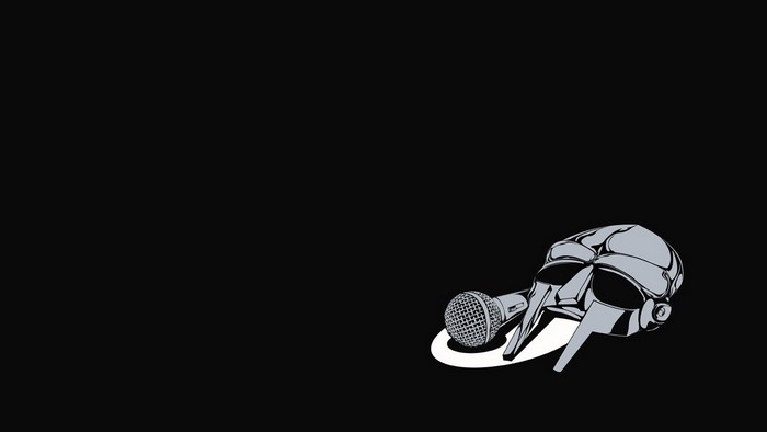 MF DOOM mask and microphone on black background