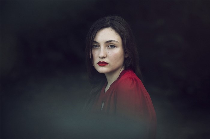 Woman in red dress with red lipstick