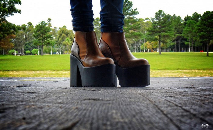 Person wearing platform boots in a park