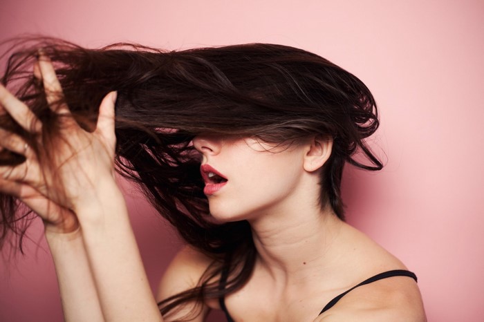 Woman with Long Dark Hair Covering Face