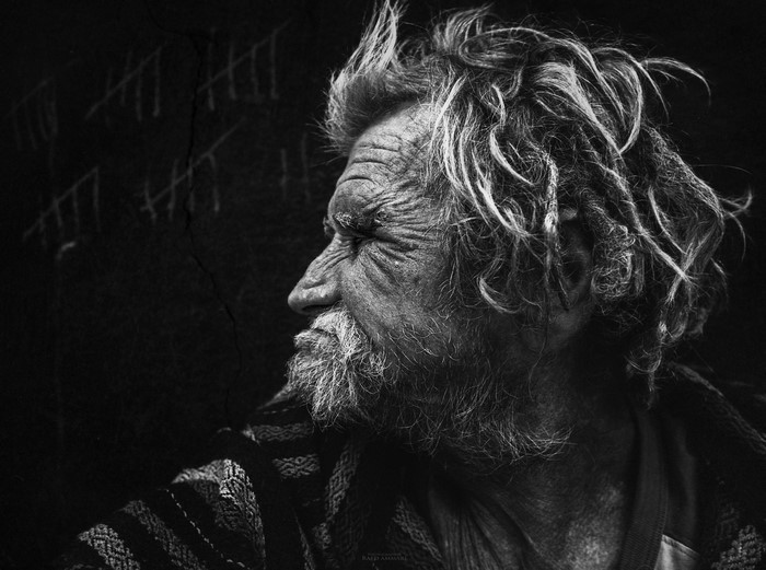 Monochrome portrait of an old man with tally marks