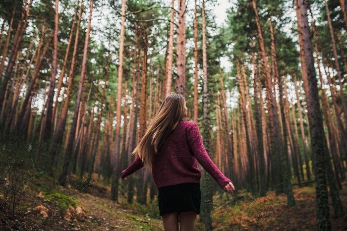 Woman with long hair in a forest