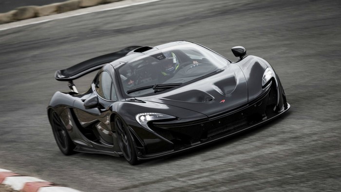 Black McLaren P1 supercar on a race track