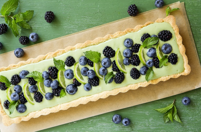 Rectangular tart with blueberries, blackberries, lime, and mint