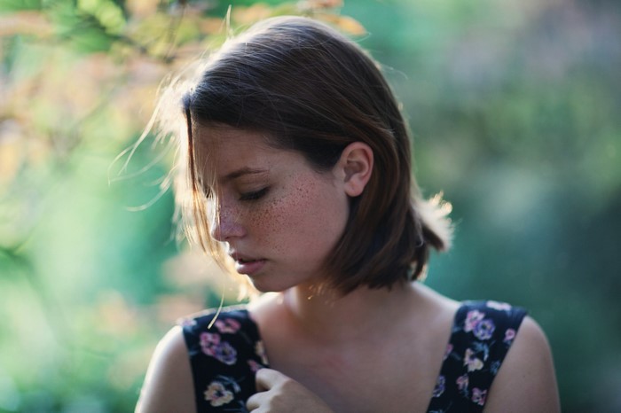 Portrait of a Woman with Freckles and Brown Hair