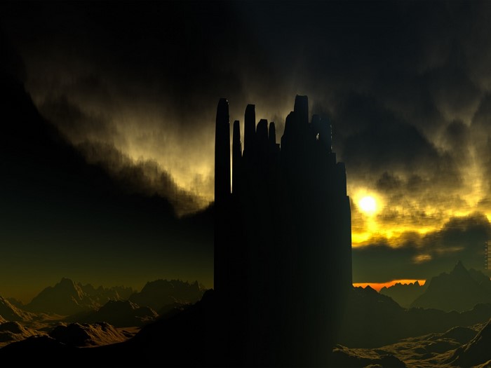 Silhouette of a castle against a dramatic sunset sky