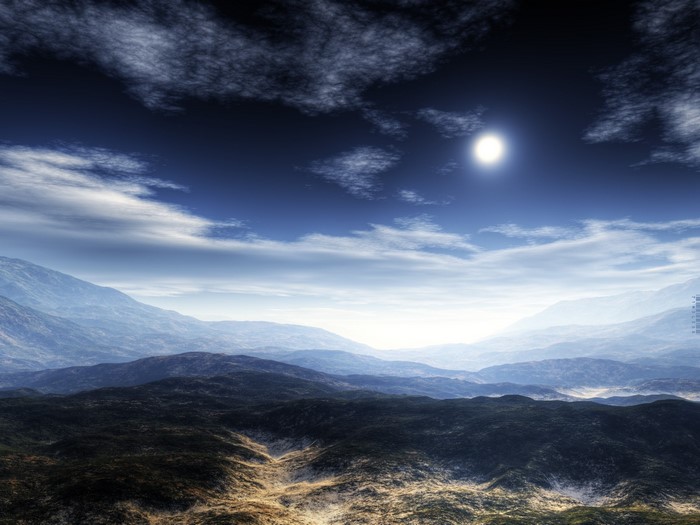 Sunlight over misty mountains and hills