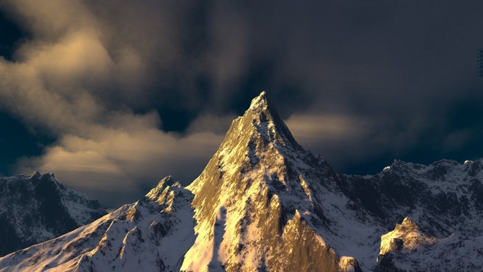 Snow-covered mountain peak illuminated by sunlight