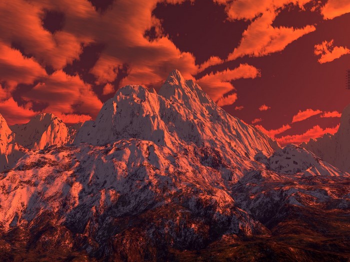 Snow-capped mountains under a red sunset sky