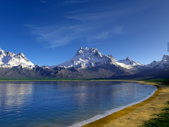 Snow-capped mountains reflected in a calm lake